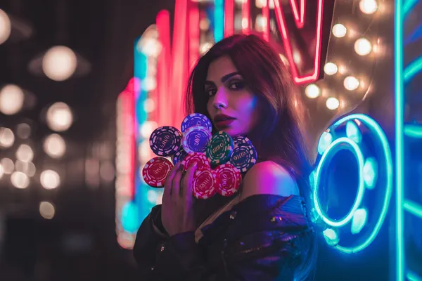A woman in a luxurious green gown next to an ornate roulette wheel, capturing the upscale casino mood of 5XGAME.