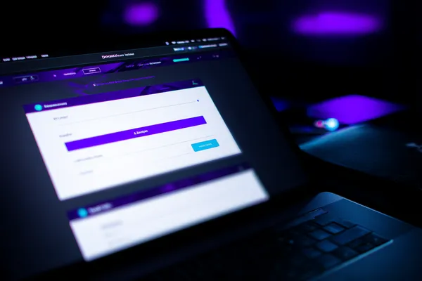 A confident dealer surrounded by casino chips inviting players to access their 5XGAME account, reflecting quick and easy login options.