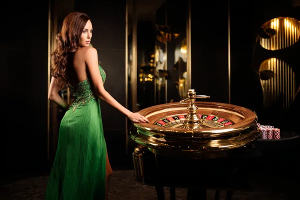 A person using their device against a moody casino-themed background, illustrating the smooth re-entry process at 5XGAME.